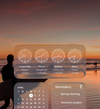 Liquid Glass Clock, Calendar, Reminders, and Weather widgets on macOS Tahoe screen over a scene of a surfer walking on the beach at sunset