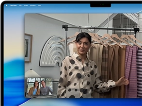 A video call on a MacBook Pro where a woman shows fabrics to two people on the call, with Center Stage keeping her centered in the frame as she moves around