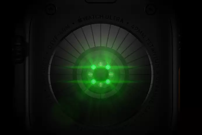 Back of Apple Watch Ultra 4, titanium case, black color, multiple round sensors with glowing green LED lights