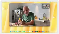 Desk View demonstration. Person on a video call watching top-down view of a baker decorating a cookie