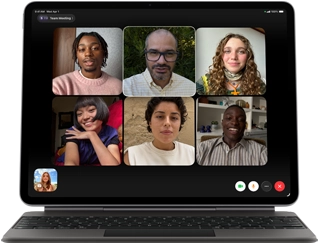 iPad Air, attached to Magic Keyboard, Black color, Group FaceTime call on screen