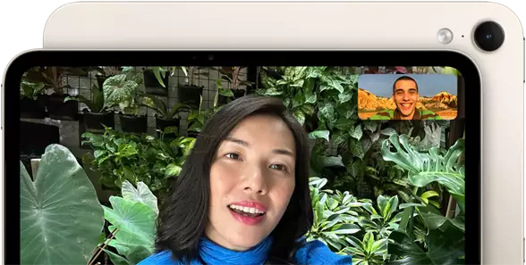 iPad mini, front view, displaying a Landscape 12MP Center Stage front camera interface, showing a person video calling amidst green foliage