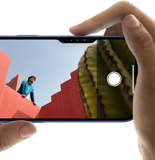 Camera Control on iPhone 16, right finger slides along side of phone to adjust camera settings