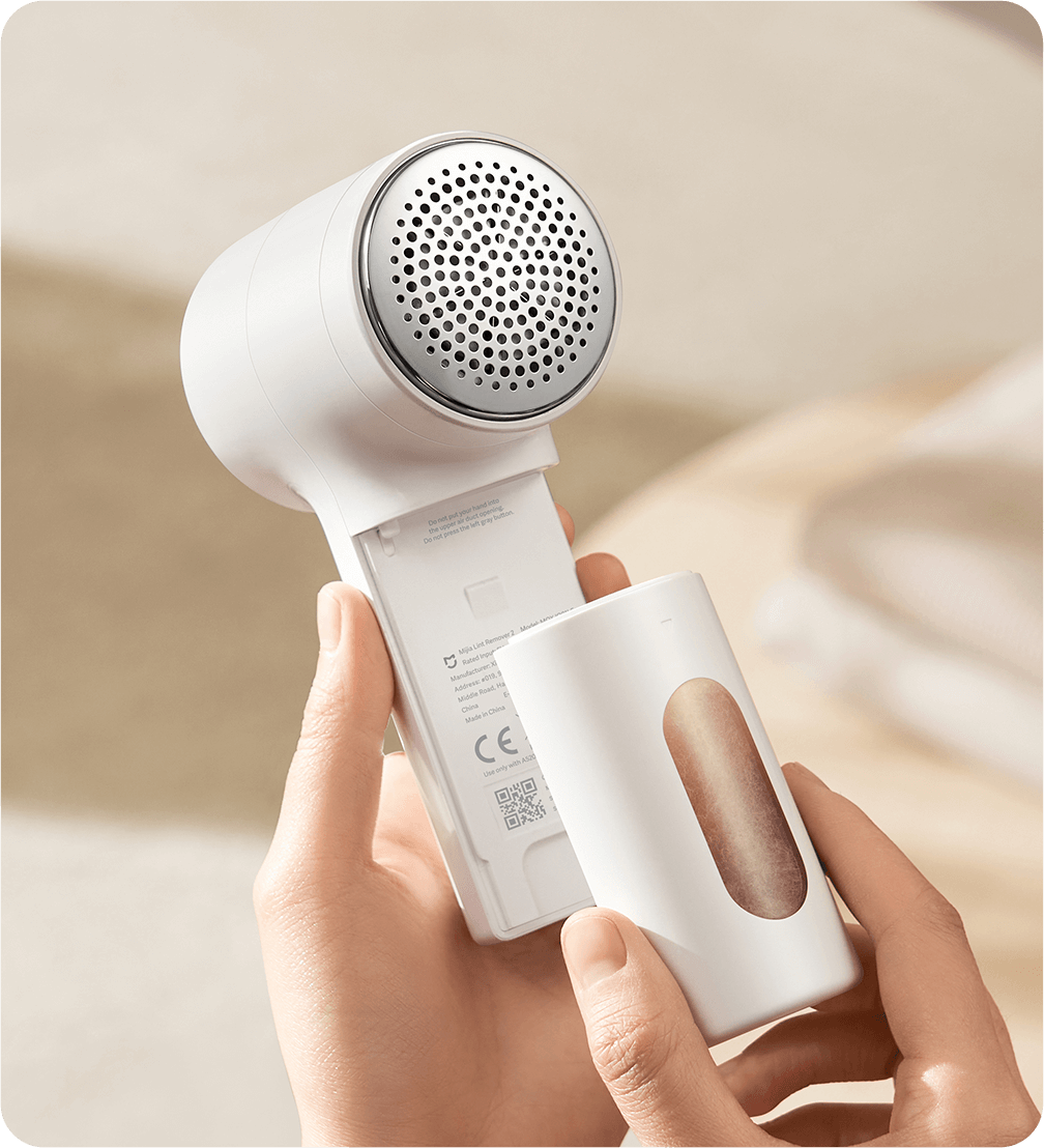 Изваждане на прозрачния контейнер за мъх на Xiaomi Mijia Lint Remover 2