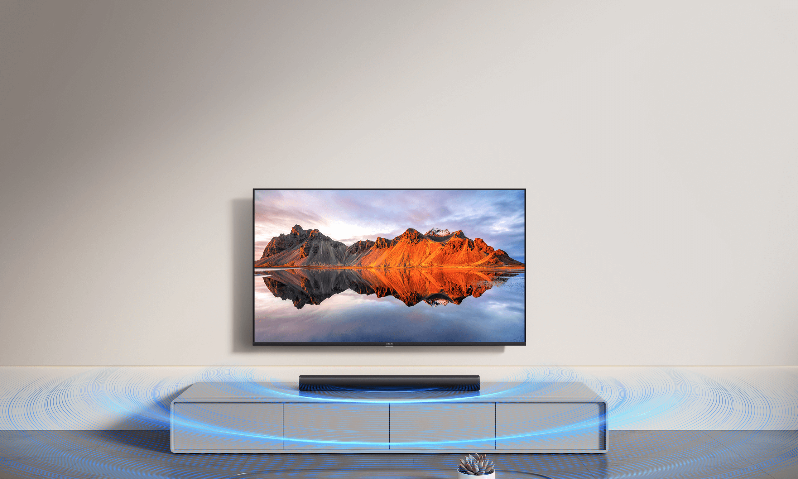 Саундбар Xiaomi Soundbar 2.0ch под телевизор в дневна със звукови вълни