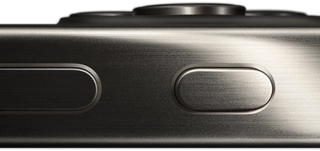 Side view of iPhone 15 Pro in a titanium design showing a volume button and Action button